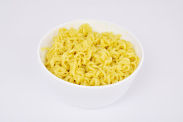 Cooked yellow noodles in bowl on white background