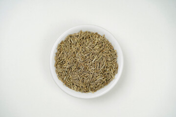 Top view of cumin seeds isolated on white background