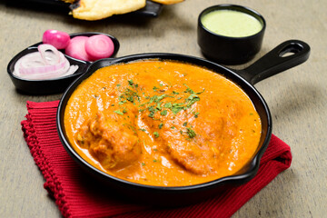 Closeup of butter chicken in plate