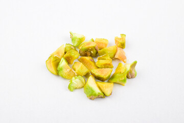 Closeup of chopped pistachio isolated on white background