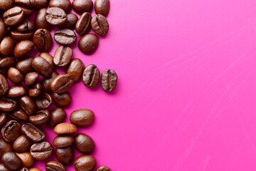 Roasted coffee beans on purple background with text space