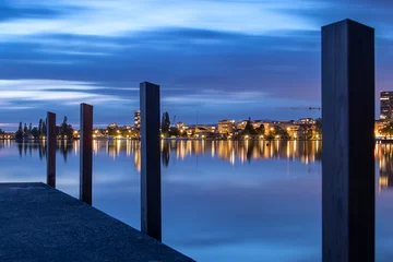 Fotobehang Pier On the shores of Lake Zug in the evening at the blue hour  © Remo Peer