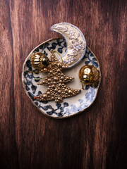 Christmas decoration on rustic stone background. Soft focus. Top view. Copy space.