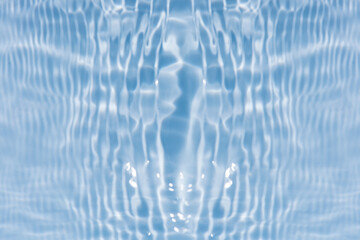 Defocus blurred transparent blue colored clear calm water surface texture with splashes reflection. Trendy abstract nature background. Water waves in sunlight with copy space. Blue watercolor shine.