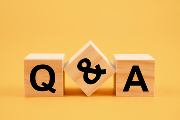 Q and A - an abbreviation of wooden blocks with letters. - obrazy, fototapety, plakaty
