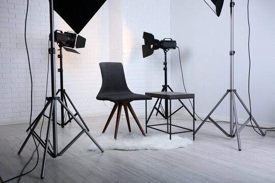 Photo Studio With Modern Interior And Lighting Equipment