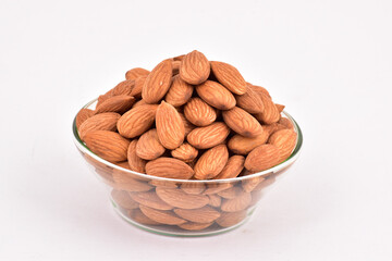 Almond in bowl on white background