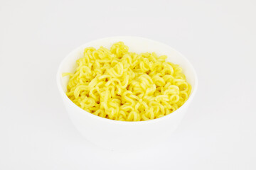 Yellow noodles in bowl on white background, instant food