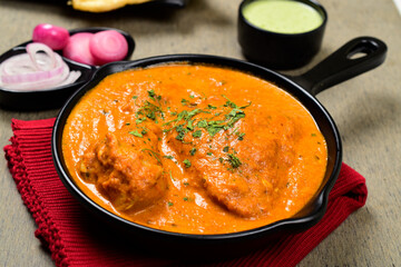 Closeup of creamy butter chicken in pan