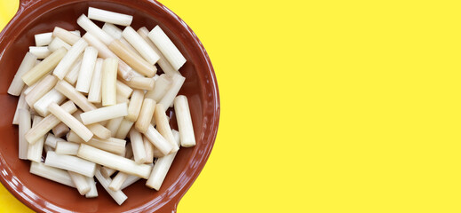 Fresh lotus rootlet on yellow background.