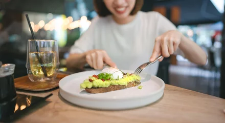 Fotobehang Guacamole avocado healthy food and asian woman background at indoor restaurant on day © dodotone