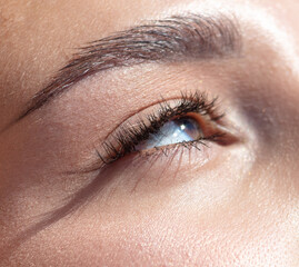 Naklejka premium Close-up of a girl's open eye. Macro