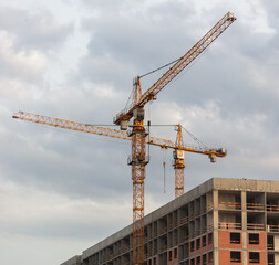 Tower crane at the construction site of a multi-story building