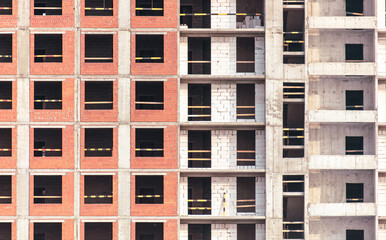 The walls of a multi-story building under construction as a background. Texture