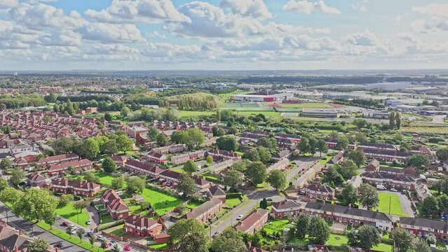 Panoramic aerial overview of subdivision homes in Doncaster England on a sunny blue sky day