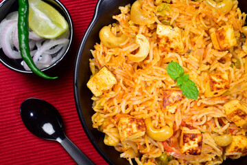 Closeup of matar paneer pulao with onion