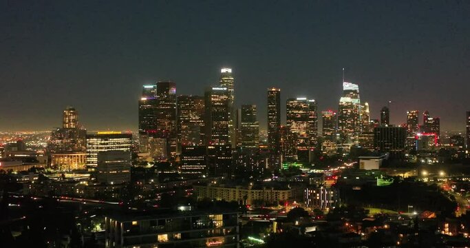 Illuminated streets downtown Los Angeles skyline at twilight dusk night. Aerial view. Los Angeles at Dusk. Aerial view of Los Angeles downtown city night skyline. LA valley California cityscape night