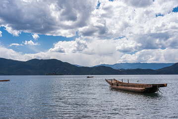 Pig trough boats on the surface of Lugu Lake in China