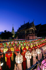 Lanterns made of colorful paper are hung during the annual festival at Wat Phra That Hariphunchai in Lamphun Province.