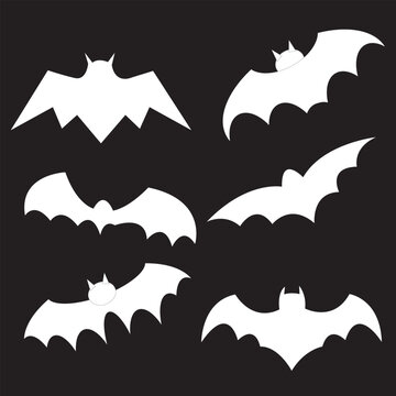 Black silhouettes of bats set on black background.