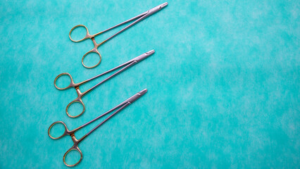 Fototapeta premium Flat lay of Halsey Needle Holder medical instruments. Medical Surgical Instrument. Equipment used in surgery.