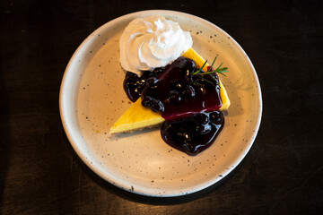 Sheet cake sprinkled with berry shapes and cream.