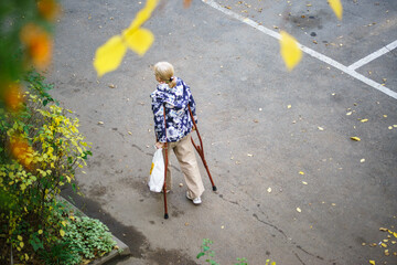 Disabled woman walking in autumn