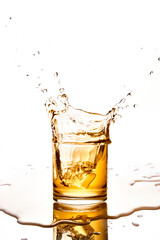 Ice Splashing into Glass with Whiskey