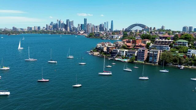 Drone aerial landscape scenic view Cremorne Point Neutral Bay Mosman Sydney City CBD skyline Harbour yachts apartment buildings real estate NSW Australia 4K