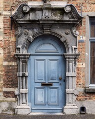Old-fashioned blue wooden door in Antwerp, Flanders, Belgium,