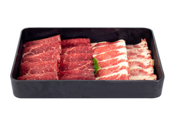 Sliced ​​raw Wagyu beef for shabu shabu or yakiniku grilling on a black plate on a table. food concept
