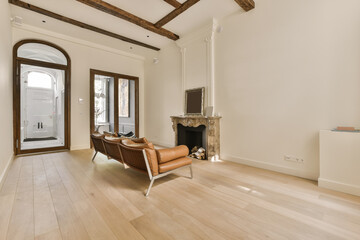 an empty living room with wood flooring and exposed beams in the ceiling is made from white oak planks