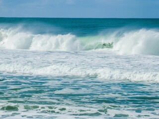 Dramatic, powerful waves crashing against the shoreline in the Atlantic Ocean near Lisbon, Portugal