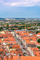 Fototapeta na wymiar Panoramic view, aerial skyline of Landshut in Bavaria. Saint Martin cathedral, Martinskirch in old town and cathedrals, architecture, roofs of houses, streets landscape, Landshut, Germany. Vertical
