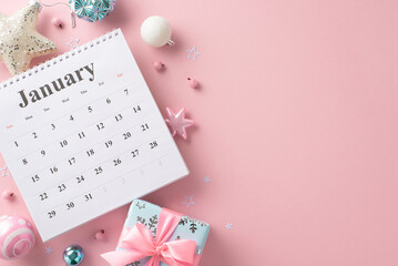 Welcoming the New Year: top-view snapshot featuring January calendar, glittering ornaments, shining star, dainty gift box with bow, holly berries, all on pastel pink backdrop with room for text or ads - obrazy, fototapety, plakaty