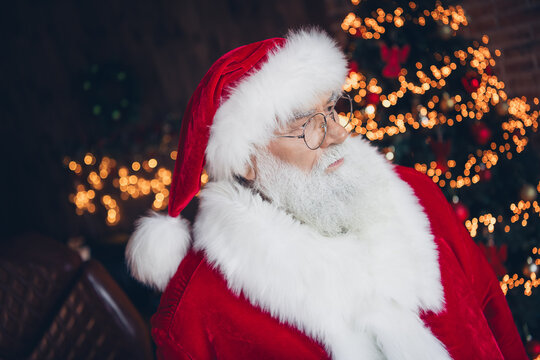 Photo of serious confident santa claus dressed red eyewear thinking presents indoors christmas north pole home - Powered by Adobe