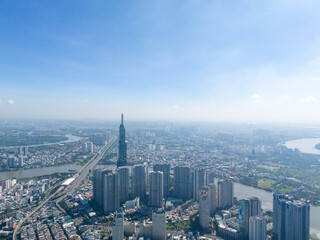 aerial view of early morning at Landmark 81 is a super tall skyscraper in center Ho Chi Minh City, Vietnam and Saigon bridge with development buildings, energy power infrastructure.