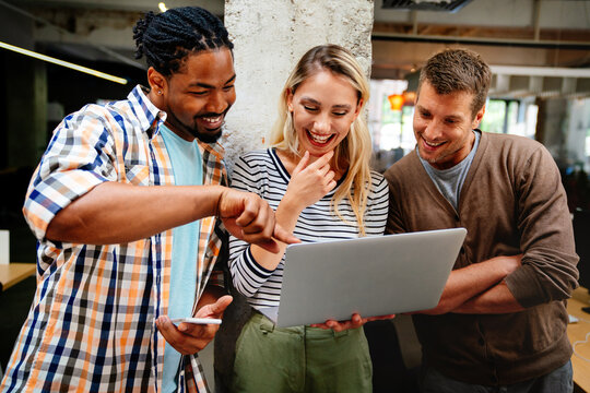 Business solutions, technology and strategy concept. Colleagues working and brainstorming in office