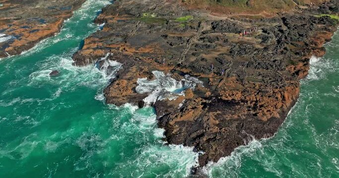 Located in the Cape Perpetua Scenic Area, just three miles south of Yachats Oregon, Thor's Well is a bowl-shaped hole carved out of the rough basalt shoreline.