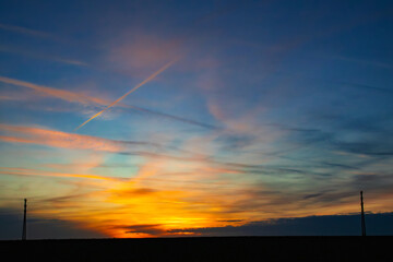 Electric pylons at sunset sky. - 668034984