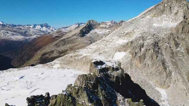 spectacular view of high altitude glacier and glacial lake behind sharp rocky Poncione di Cassina Baggio mountains featuring famous Swiss mountain pass Gerenpass near Ch&uuml;ebodengletscher in Switzerland