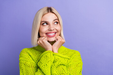 Photo of dreamy sweet woman dressed knitted sweater arms cheeks looking empty space isolated violet color background