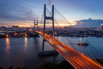 Fototapeta na wymiar Sunset on Phu My bridge, Saigon riverside, Ho Chi Minh city, Vietnam.