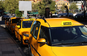 NEW, MODERN empty taxi on a car parking in MEYDAN, FORUM. Big Line of Yellow Taxis. Row of yellow...