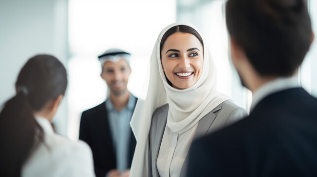 Dubai business woman talking with foreign business people in the white office