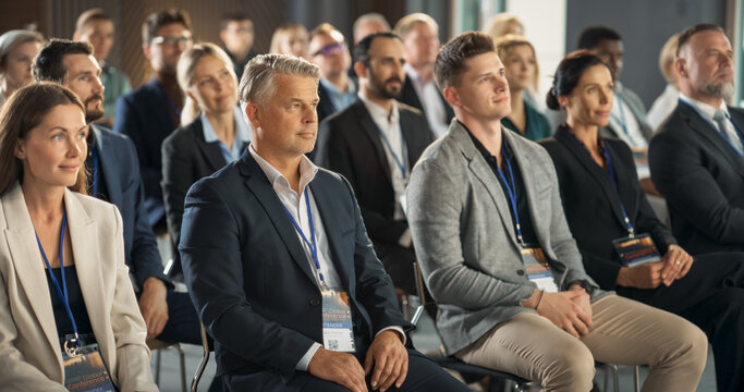 Diverse Researchers Sitting In Audience At International Science Conference. Industry Leaders And Scientists Listening To Presentations About New Developments In Ecology, Technology, Medicine.