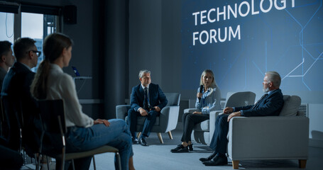 International Technology Conference: Male Host Asking Caucasian Female CEO a Question In Front Of...