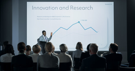 Corporate Event: Black Male Tech CEO Giving Presentation To Colleagues or Investors In the...
