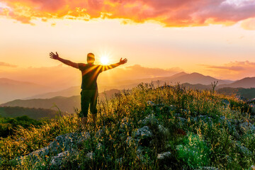 man doing hiking sport in mountains with anazing highland view