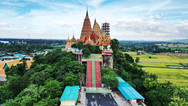 Wat Tham Suea is a temple and tourist attraction have large Buddha image. Located on top of a hill is a beautiful view of the surrounding rice fields. Located at Kanchanaburi Province in Thailand.